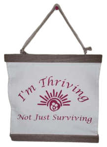 A bag that says i 'm thriving not just surviving